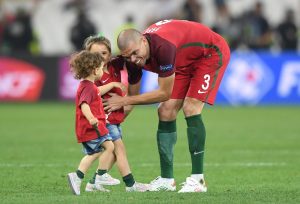 Pepe of Portugal plays with his children after the penalty shootout of the UEFA EURO 2016 quarter final soccer match between Poland and Portugal at the Stade Velodrome in Marseille, France, 30 June 2016. Photo: Federico Gambarini/dpa (RESTRICTIONS APPLY: For editorial news reporting purposes only. Not used for commercial or marketing purposes without prior written approval of UEFA. Images must appear as still images and must not emulate match action video footage. Photographs published in online publications (whether via the Internet or otherwise) shall have an interval of at least 20 seconds between the posting.) +++(c) dpa - Bildfunk+++